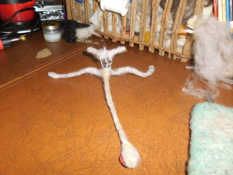 The same wool as in pic #10, after being doused in hot water and blue Dawn dish soap, twirled between flat hands (a lot), and rinsed, rolled some more, and dried. Pic #11