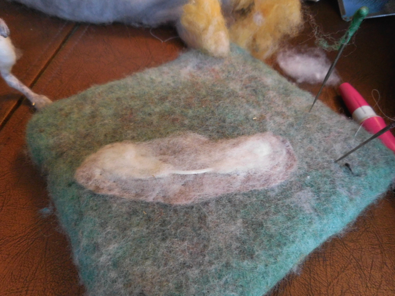 Fortunately, it took just a bit of white wool to hide the waxed parts of the ear armature. (The middle doesn’t matter as it will be out of sight inside the head.) Pic #29: New ear