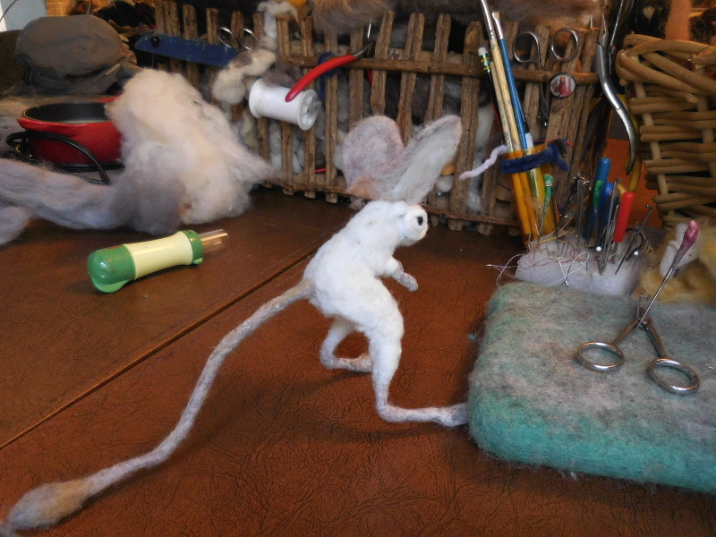 With the front mostly tucked in, the back part of the piece can slide forward to shape the lower part by the earhole. Pic #31: Ears from back