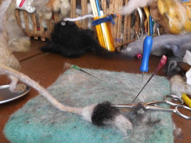 Setting long hair almost always winds up with way too much fiber obscuring the pattern. Scissors to the rescue again! Pic #42: Tail trimming
